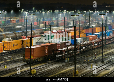 Parked freight trains at Maschen railroad shunting yard near Hamburg at night, Lower Saxony, Germany Stock Photo