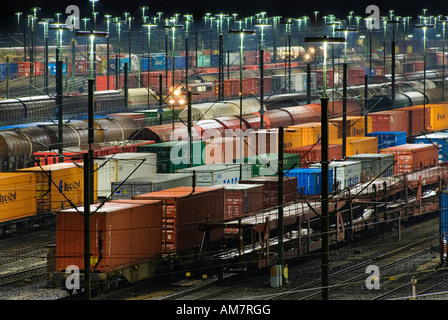 Parked freight trains at Maschen railroad shunting yard near Hamburg at night, Lower Saxony, Germany Stock Photo