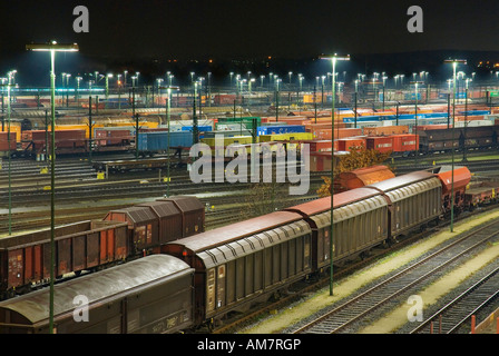 Parked freight trains at Maschen railroad shunting yard near Hamburg at night, Lower Saxony, Germany Stock Photo