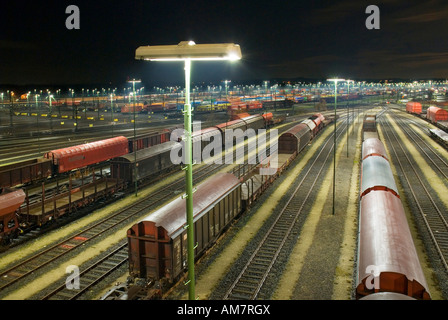 Parked freight trains at Maschen railroad shunting yard near Hamburg at night, Lower Saxony, Germany Stock Photo