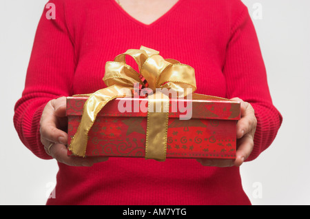 Woman Holding Christmas Present Stock Photo