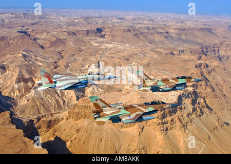 A formation of 2 F16 and one F15 Israeli Air Force fighter jets flying over Masada Dead sea area Stock Photo