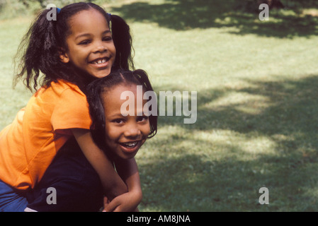 Sisters enjoying at park, portrait Stock Photo