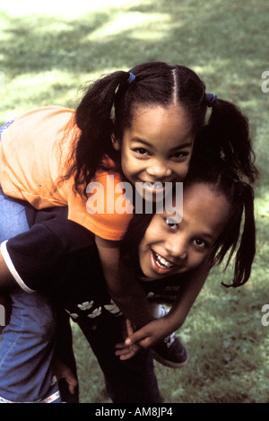 Sisters enjoying at park, portrait Stock Photo