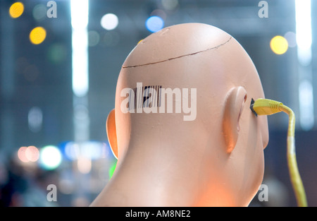 mannequin head with barcode connected to ethernet cable Stock Photo