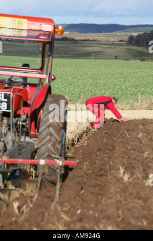 Tractor and ploughman at the 2007 Scottish Ploughing Championships held at Pusk Farm, Balmullo, St Andrews, Fife, Scotland, UK Stock Photo