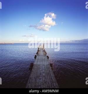 A long dock over a water. Stock Photo