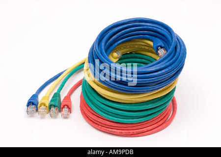 4 reels of coloured ethernet cable stacked on top of each other Stock Photo