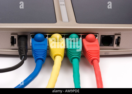 Ethernet cables plugged into router against white background Stock Photo