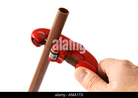 Cutting a 15mm copper pipe. Stock Photo