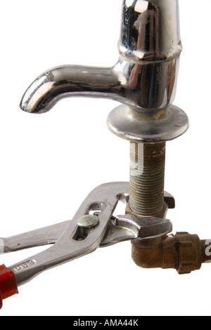 Working on an old water tap pipework. Stock Photo