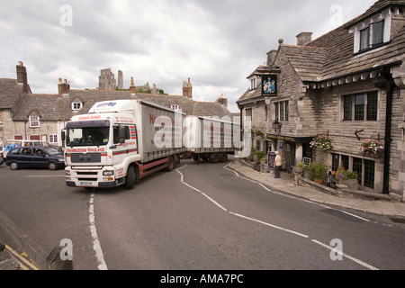 UK Dorset Corfe Castle heavy articulated lorry blocking road whilst passing through village Stock Photo