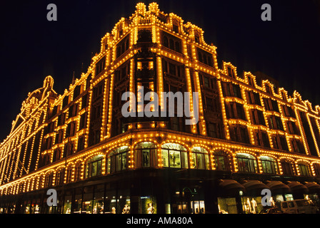 England London Knightsbridge Harrods department store outlined in lights at night Stock Photo