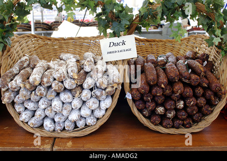 Dried sausages of all varieties for sale on a French market stall in Calais Stock Photo