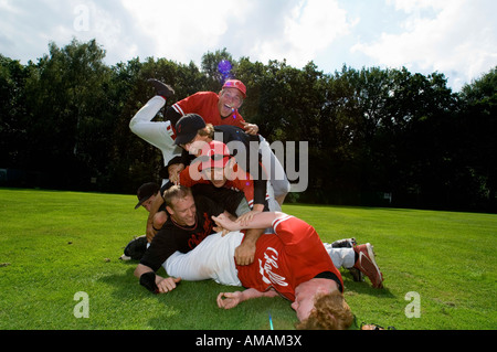 A baseball team piled on top of one another Stock Photo