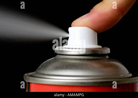 spraying red color with an aerosol can on a white blanket Stock Photo ...