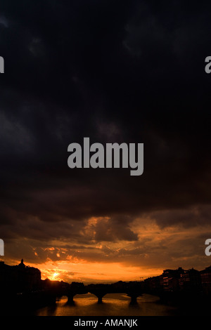 Moody sunset over Arno river in Pisa, Italy Stock Photo - Alamy