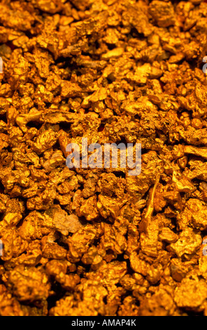 Assorted small gold nuggets Stock Photo