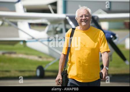 Senior caucasian male with Cessna aircraft Stock Photo