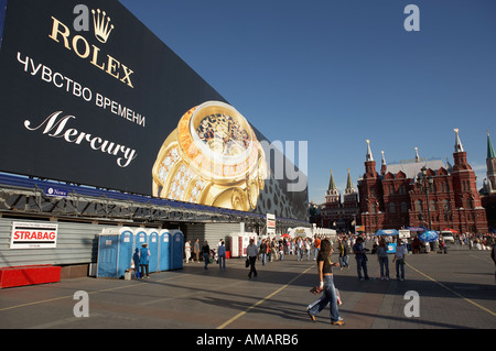 LARGE ROLEX WATCH ADVERTISEMENT AND CROWDS IN MANEZHNAYA SQUARE MOSCOW RUSSIA Stock Photo