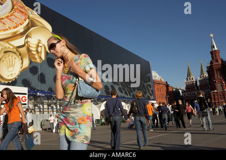 LARGE ROLEX WATCH ADVERTISEMENT AND CROWDS IN MANEZHNAYA SQUARE MOSCOW RUSSIA Stock Photo