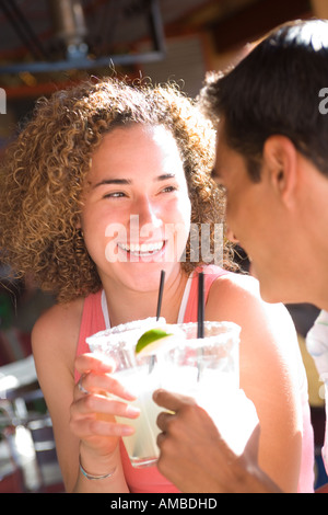 young couple in outdoor cafe having a drink Stock Photo