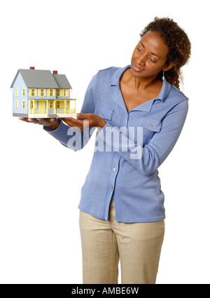 Woman holding model house Stock Photo