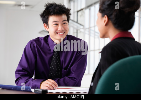 Two business executives discussing in office. Stock Photo
