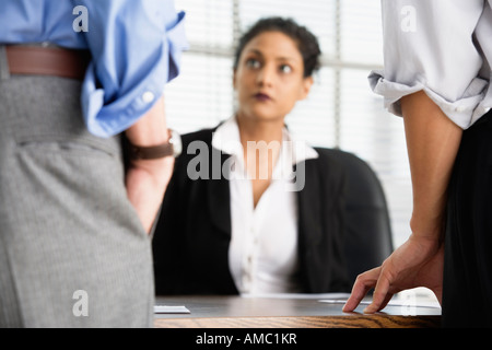 View of businesspeople engaged in a discussion in an office. Stock Photo