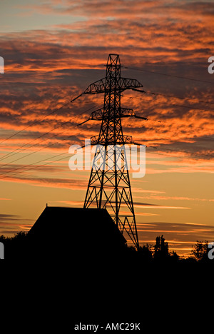 silhouettes of electricity pylons in birmingham Stock Photo