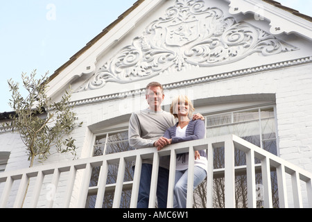 Couple Standing on Balcony Stock Photo