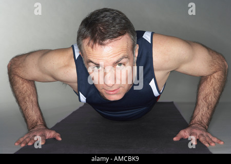 Man Doing Push-Ups Stock Photo