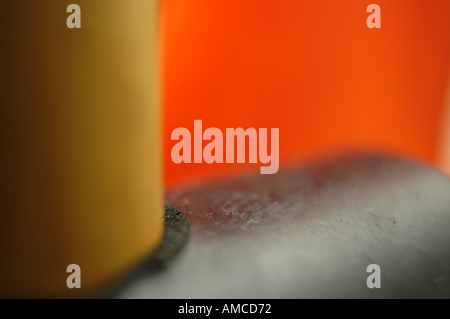 A close-up of a rubber mallet on a red background. Stock Photo