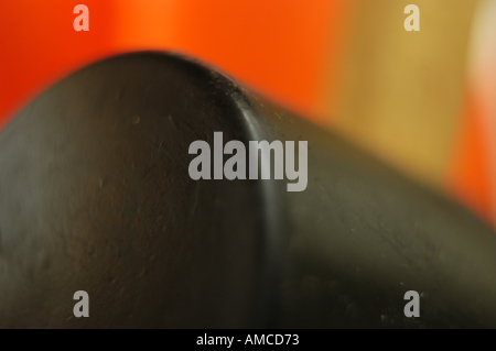 A close-up of a rubber mallet on a red background. Stock Photo