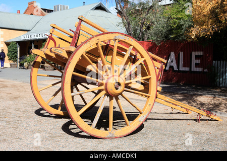 Orange wooden dray detail on Murray Esplanade historic precinct Echuca Victoria Australia Stock Photo
