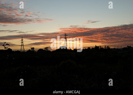 silhouettes of electricity pylons in birmingham Stock Photo