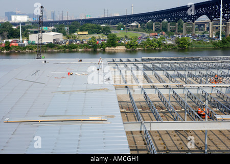 Warehouse Construction Corrugated Steel Roofing Sections on Steel Framework Stock Photo