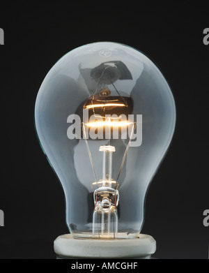 Glowing Tungsten Filament in Electric Light Bulb Stock Photo