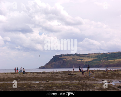 Beach at Robin Hoods Bay with a Kite flyer Stock Photo
