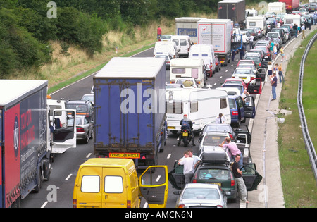PASSENGERS GET OUT OF THEIR CARS IN HOLIDAY TRAFFIC STUCK ON THE M5 NEAR BRISTOL UK Stock Photo
