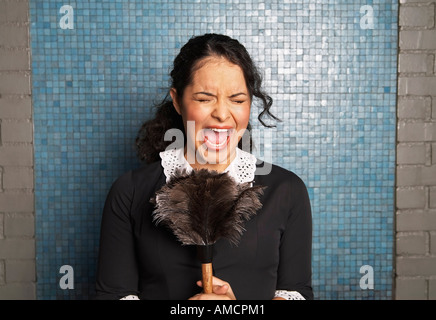 Maid Holding Duster and Screaming Stock Photo