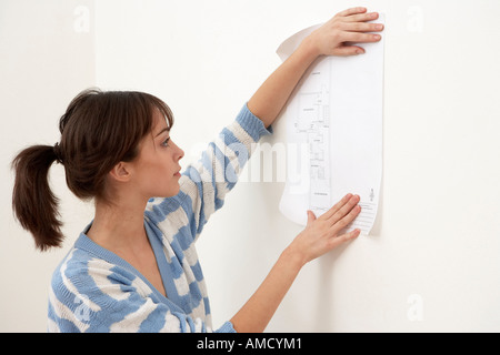 Woman Looking at Building Plans Stock Photo