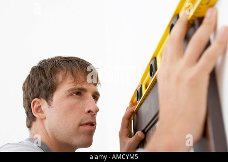 Man Hanging Picture Stock Photo