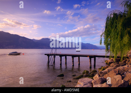 Dock and Boat on Lake, Lago di Garda, Italy Stock Photo