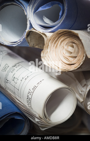 close up view rolled blueprints on board Stock Photo - Alamy