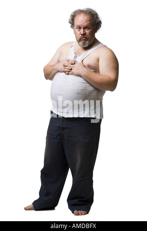 Disheveled man with hands on pot belly Stock Photo