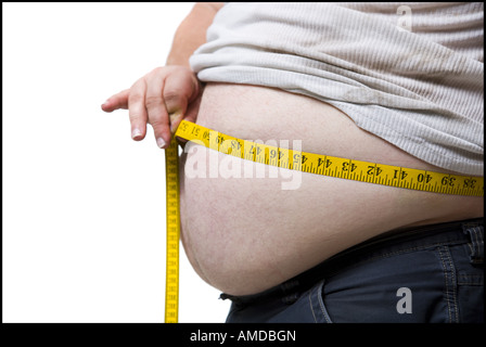 Obese man measuring waist with tape measure Stock Photo