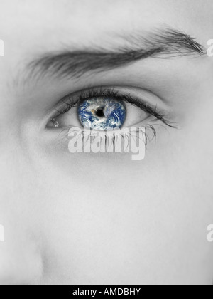 Grayscale close-up of woman's eye with earth reflection Stock Photo