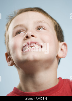 Close-up of boy smiling with missing teeth Stock Photo