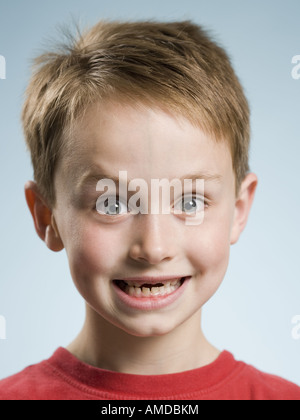 Close-up of boy smiling with missing front teeth Stock Photo